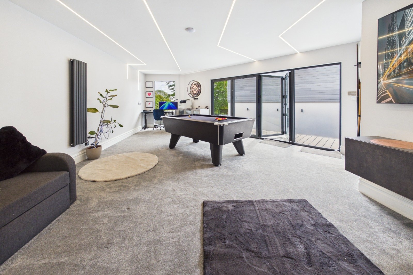 Finished annexe interior with bi-folds onto the deck, customer fit-out